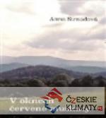 V oknech červené muškáty